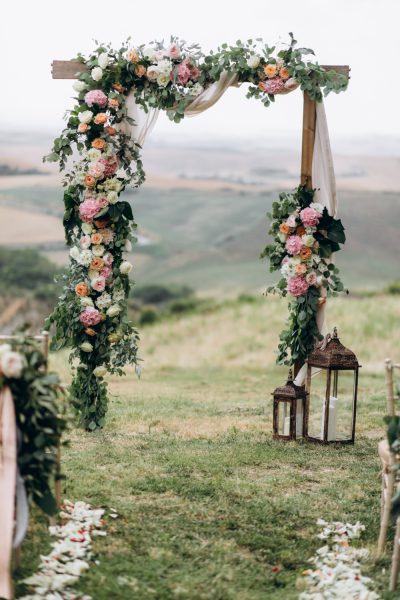 beautiful-archway-decorated-with-floral-composition-outdoors